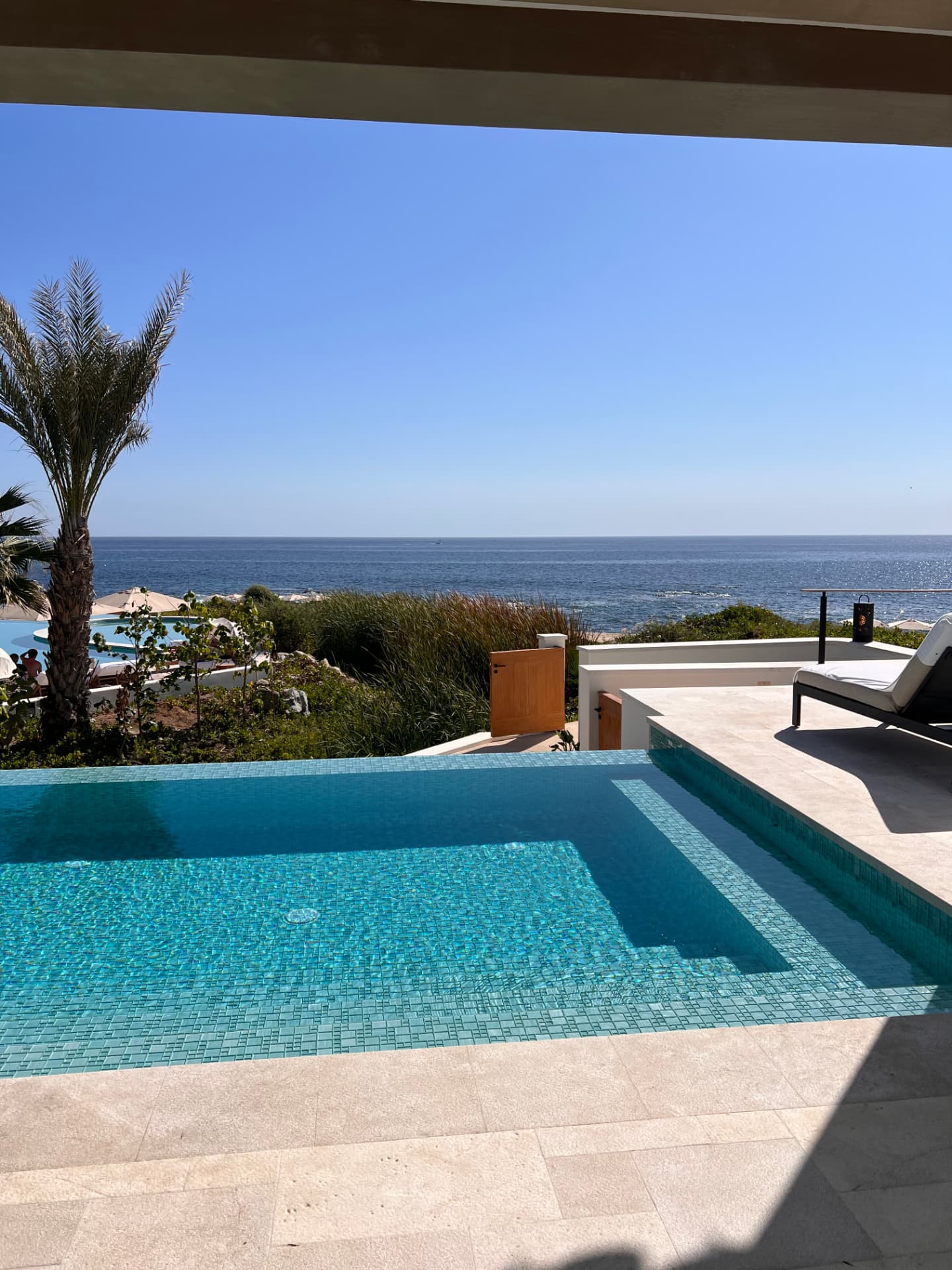 Sunlit luxury hotel suite with ocean views